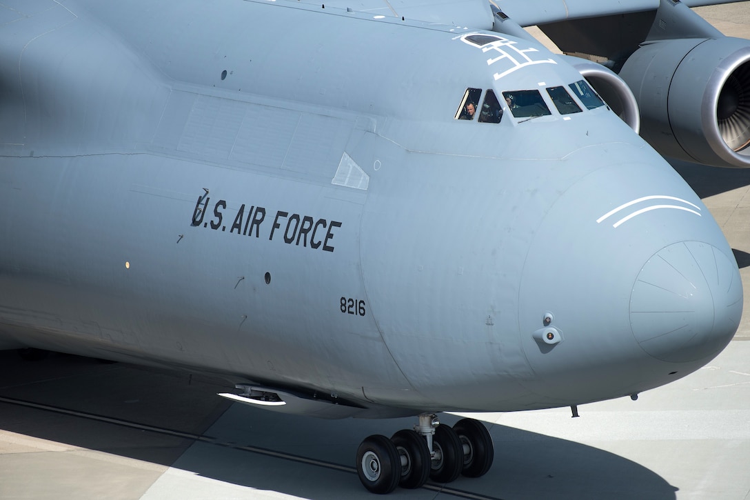 A pilot looks out the cockpit of the last C-5M Super Galaxy.