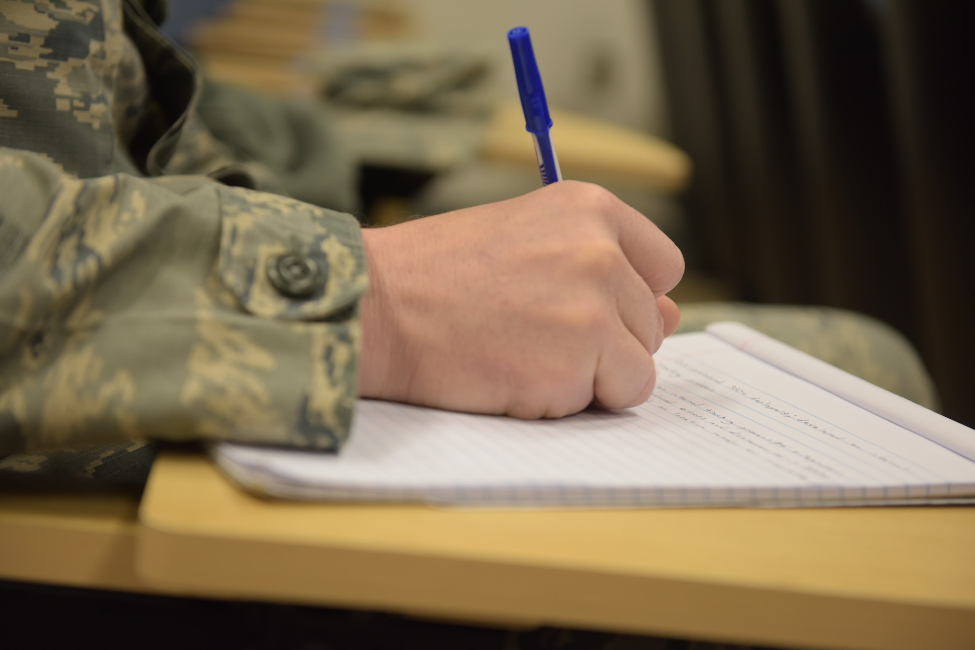 Staff Sgt. Matthew Shannon, of the individual personnel readiness office with the 911th Force Support Squadron, takes notes during an enlisted performance report bullet writing seminar at the Pittsburgh International Airport Air Reserve Station, Pennsylvania, April 8, 2018. The EPR bullet writing seminar was conducted by Chief Master Sgt. Chin M. Cox, the Office of the Joint Staff Surgeon Senior Enlisted Leader at the Pentagon, with the focus on improving Airmen's writing skills and the impact to their career. (U.S. Air Force photo by Airman 1st Class Grace Thomson)