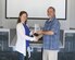 John Lamb, biologist at Arnold Air Force Base, displays his 2018 National Military Fish and Wildlife Association National Resources Conservation Management Award for Model Programs and Projects with Shannon Allen, Chief, National Environmental Policy Act, Natural and Cultural Resources, as she congratulates him. This award category recognizes resource managers who further natural resource management on military installations in support of the military mission through developing programs or projects which can serve as models for conservation on military installations. (U.S. Air Force photo/Deidre Ortiz)