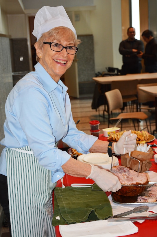 Lou Bernard, Executive Office, slices Polish ham during Diversity Day April 3, 2018, in Lower Manhattan