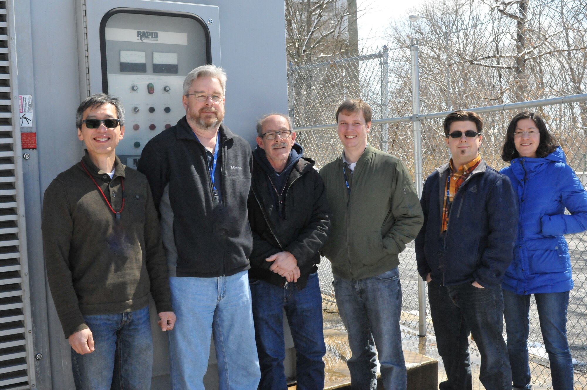 Members of the Tunnel 9 team are pictured with the electrical rectifier unit recently put into use. The unit, which was first delivered and installed in 2011, will replace an approximately 50-year-old power unit at Tunnel 9. Pictured from left are Electrical/System Engineer Tao Lee, Controls Engineer/Lead Controls Technician Ray Schlegel, Lead Electrician Ed Tierney, Chief Facility Engineer Nick Fredrick, Electrical/Data System Engineer Joel Barr and Test & Evaluation Engineer Inna Kurits.