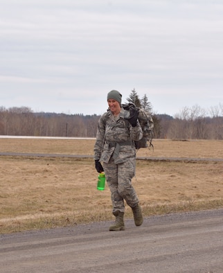 Staff Sgt. Stephanie Lambert, 109th Airlift Wing Public Affairs photojournalist, completes the ruck march portion of the German Armed Forces Forces Proficiency Badge on April 14, 2018, at Stratton Air National Guard Base, Scotia, New York. She completed 3.73 miles in just under 1 hour carrying 33 pounds in her rucksack.