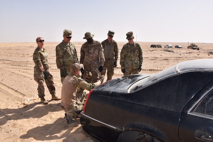 Cpl. John Bradshaw of the 797th Explosive Ordnance Disposal (EOD) Company of Fort Hood, Texas explains to the Combat Engineers of the Missouri National Guard’s 35th Engineer Brigade a way to breach the trunk of a vehicle.