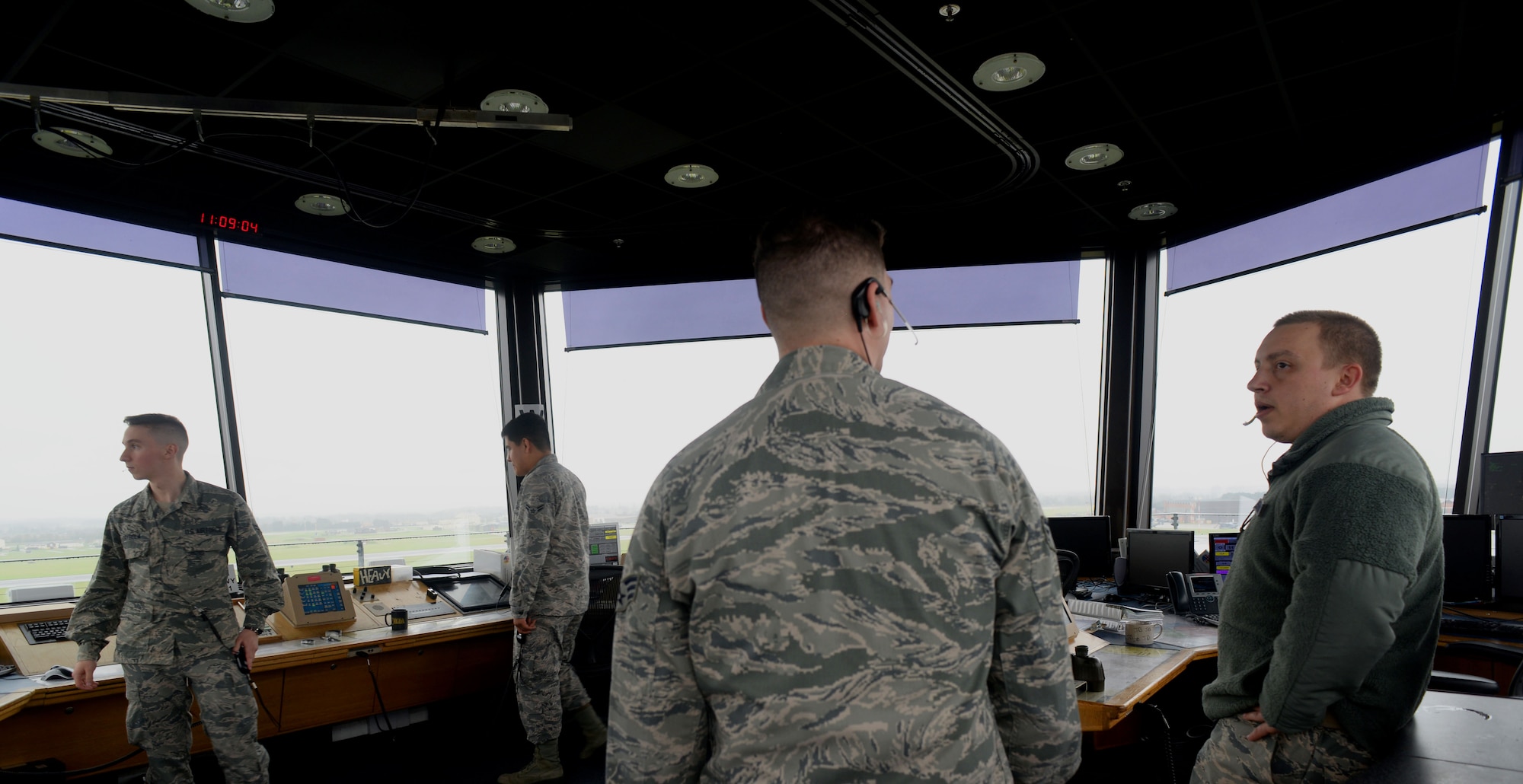 Air traffic controllers assigned to the 100th Operations Support Squadron prepare for an incoming flight at RAF Mildenhall, England, April 9, 2018. Air traffic controllers are responsible for more than just the tower; they are also charged with maintaining the ground controllers, flight data, base operations and the radar facility. All are integral pieces of the puzzle that keep Team Mildenhall refueling the fight and powering the mission. (U.S. Air Force photo by Airman 1st Class Alexandria Lee)