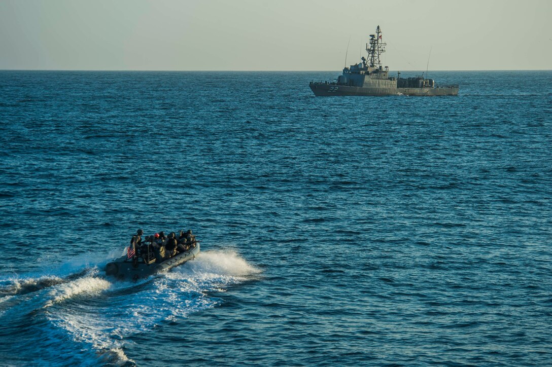 A small US Navy boat maneuvers in the Pacific.