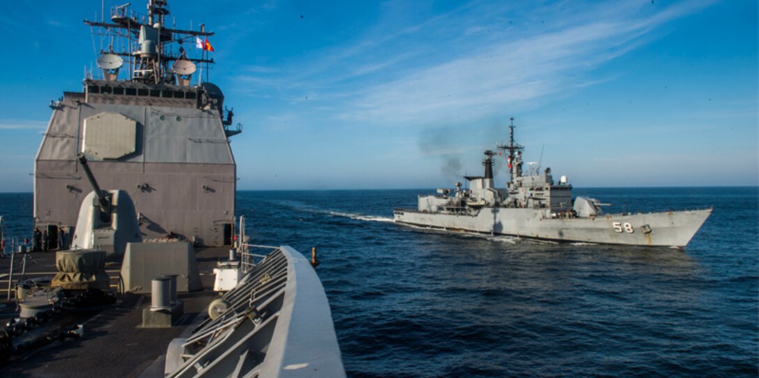 Ships sail in formation.