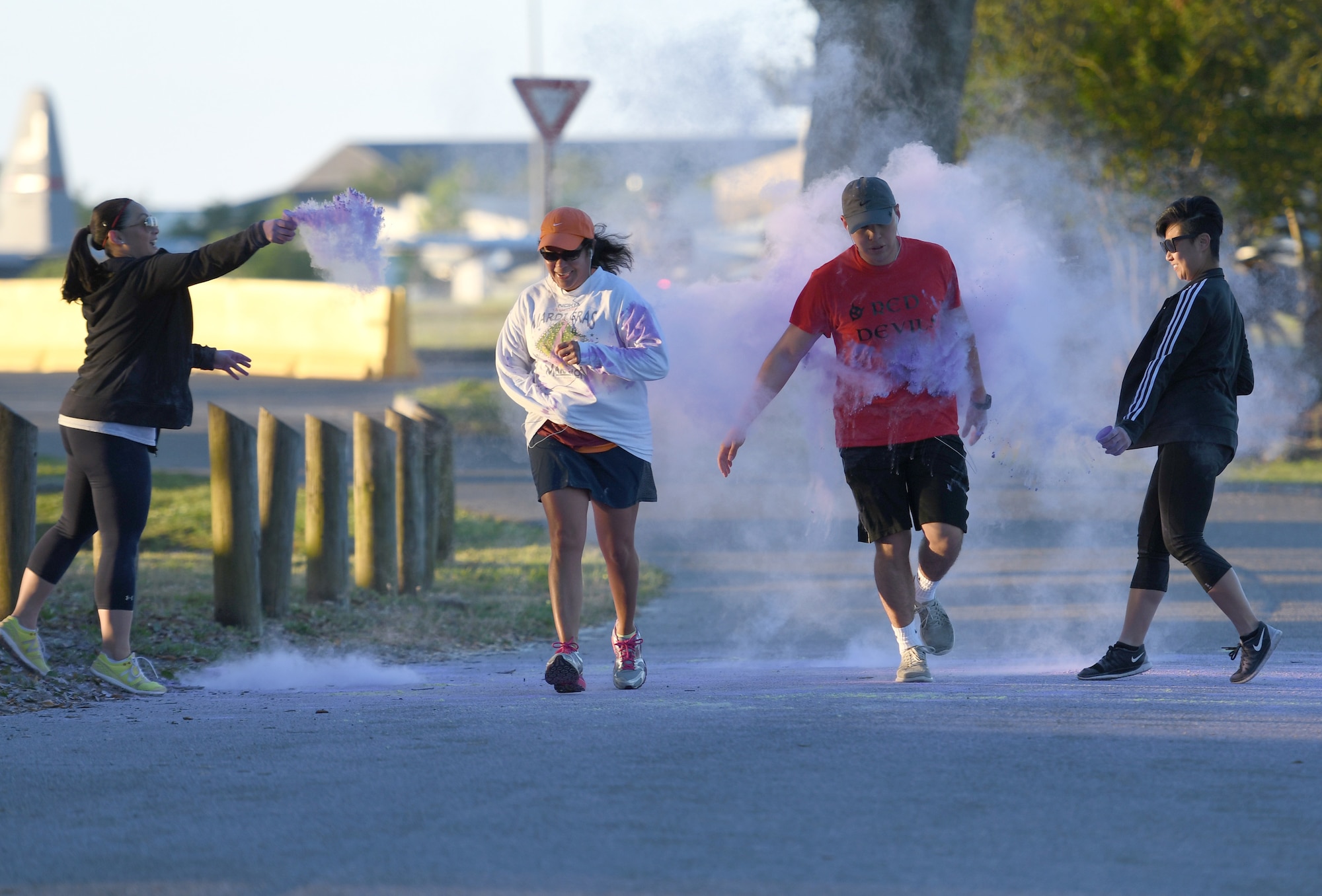 Keesler personnel participate in the Air Force Assistance Fund Color Run at Keesler Air Force Base, Mississippi, April 20, 2018. The AFAF raises funds for charitable affiliates that provide support to Air Force families in need. (U.S. Air Force photo by Kemberly Groue)