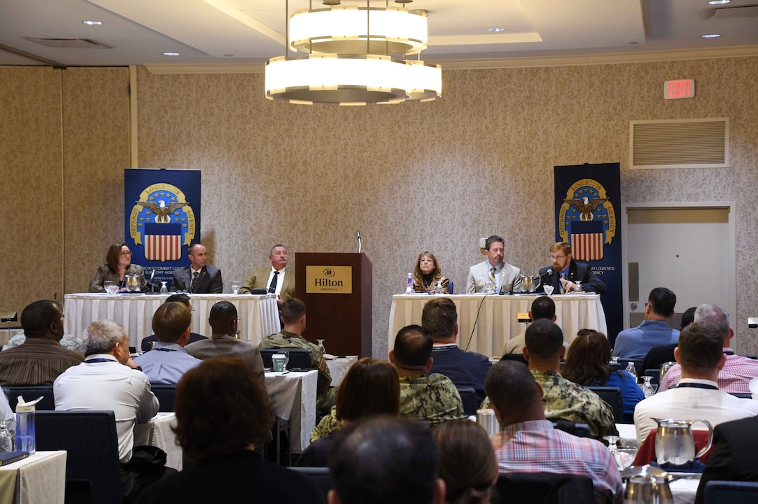 : DLA Headquarters senior leaders field questions from the audience (from left): Acquisition Deputy Director Roxanne Banks; Director of Logistics Policy and Strategic Programs George Atwood; DLA Vice Director Ted Case; Information Operations Director Kathy Cutler; Human Resources Director Brad Bunn; and Joint Contingency Acquisition Support Office Executive Director Pat Dulin.