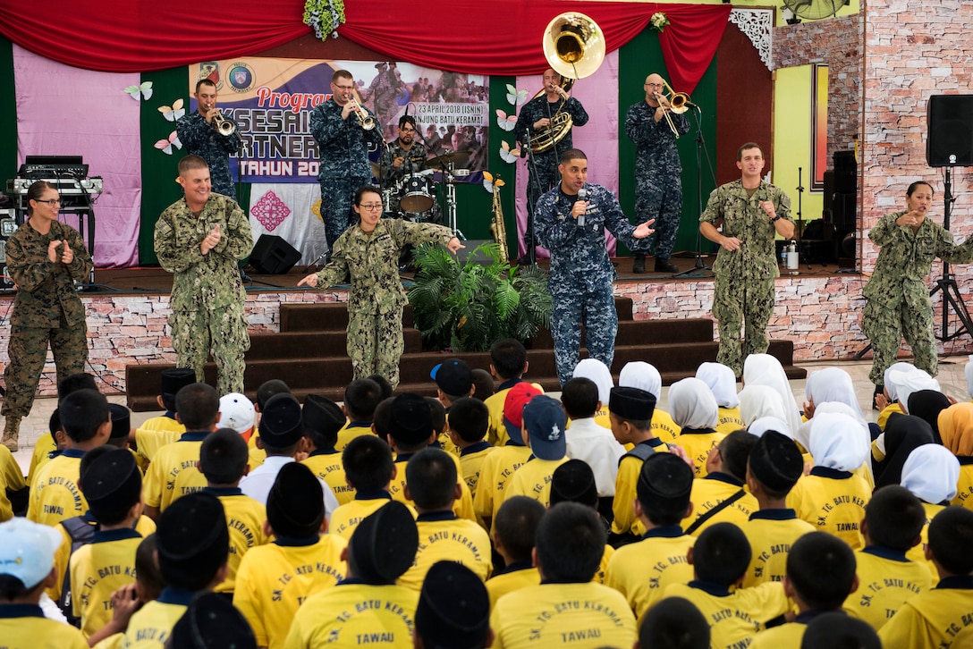 Sailors perform during a community engagement event.