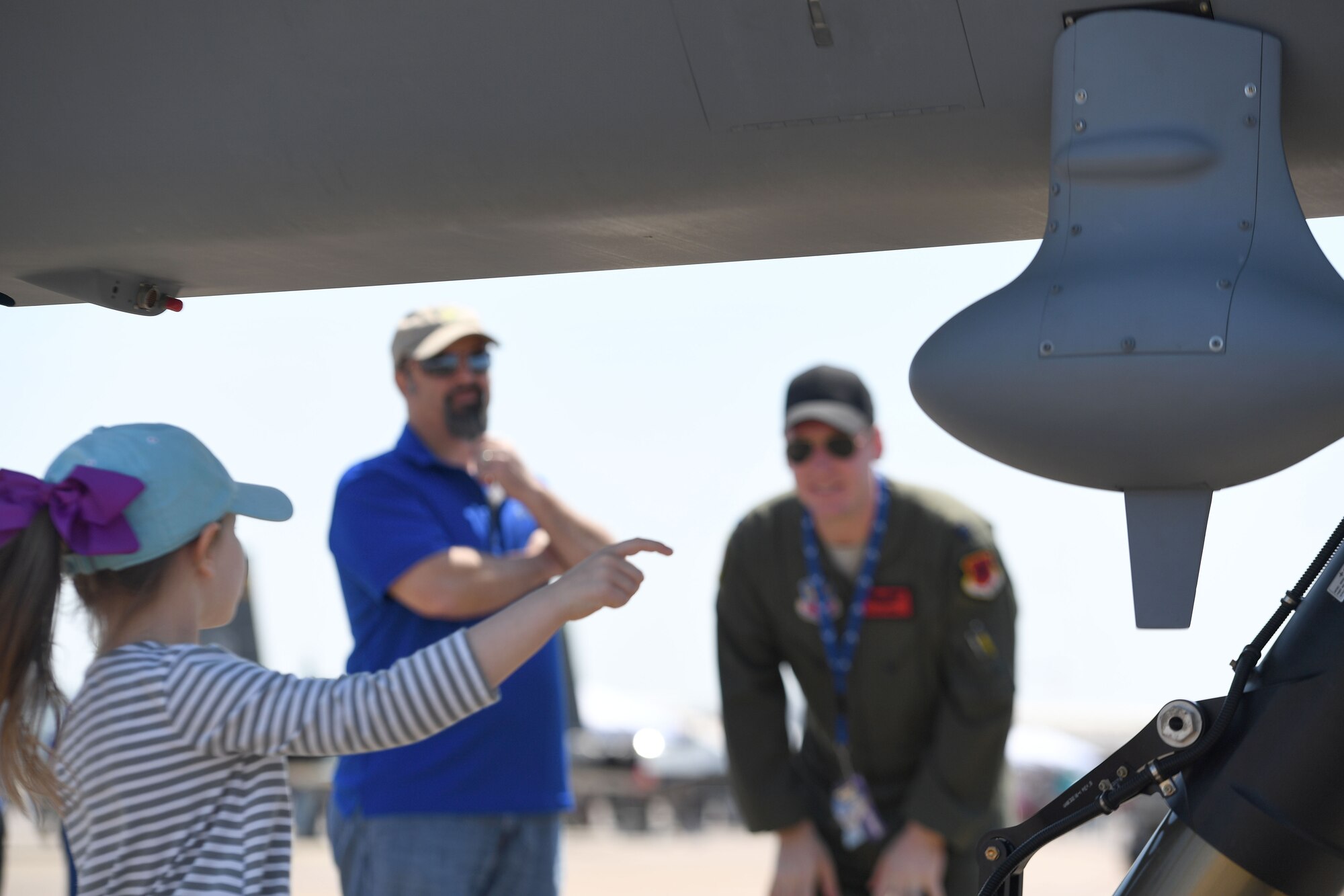 A child asks a question about the MQ-9 Reaper model during the 2018 Wings over Columbus Air and Space Expo April 21, 2018, at Columbus Air Force Base, Mississippi. The event marked the MQ-9’s first stop for the airshow season. (U.S. Air Force photo by Senior Airman James Thompson)