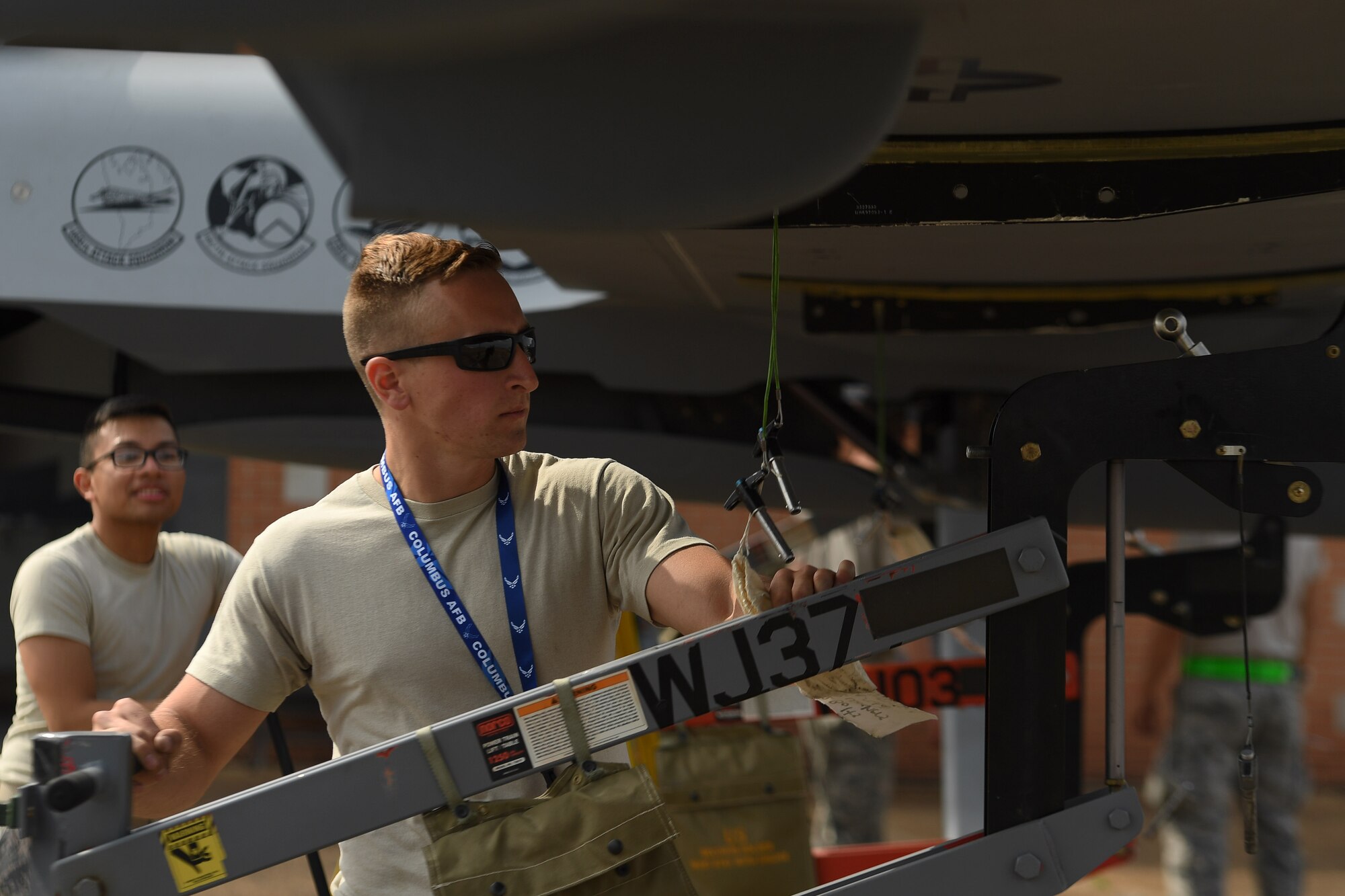 An Airman from the 432nd Maintenance Squadron uses a wing jack during the MQ-9 Reaper model disassemble process April 21, 2018 at Columbus Air Force Base, Mississippi. The MQ-9’s assemble and disassemble process requires eight to ten maintenance Airmen to complete. (U.S. Air Force photo by Senior Airman James Thompson)