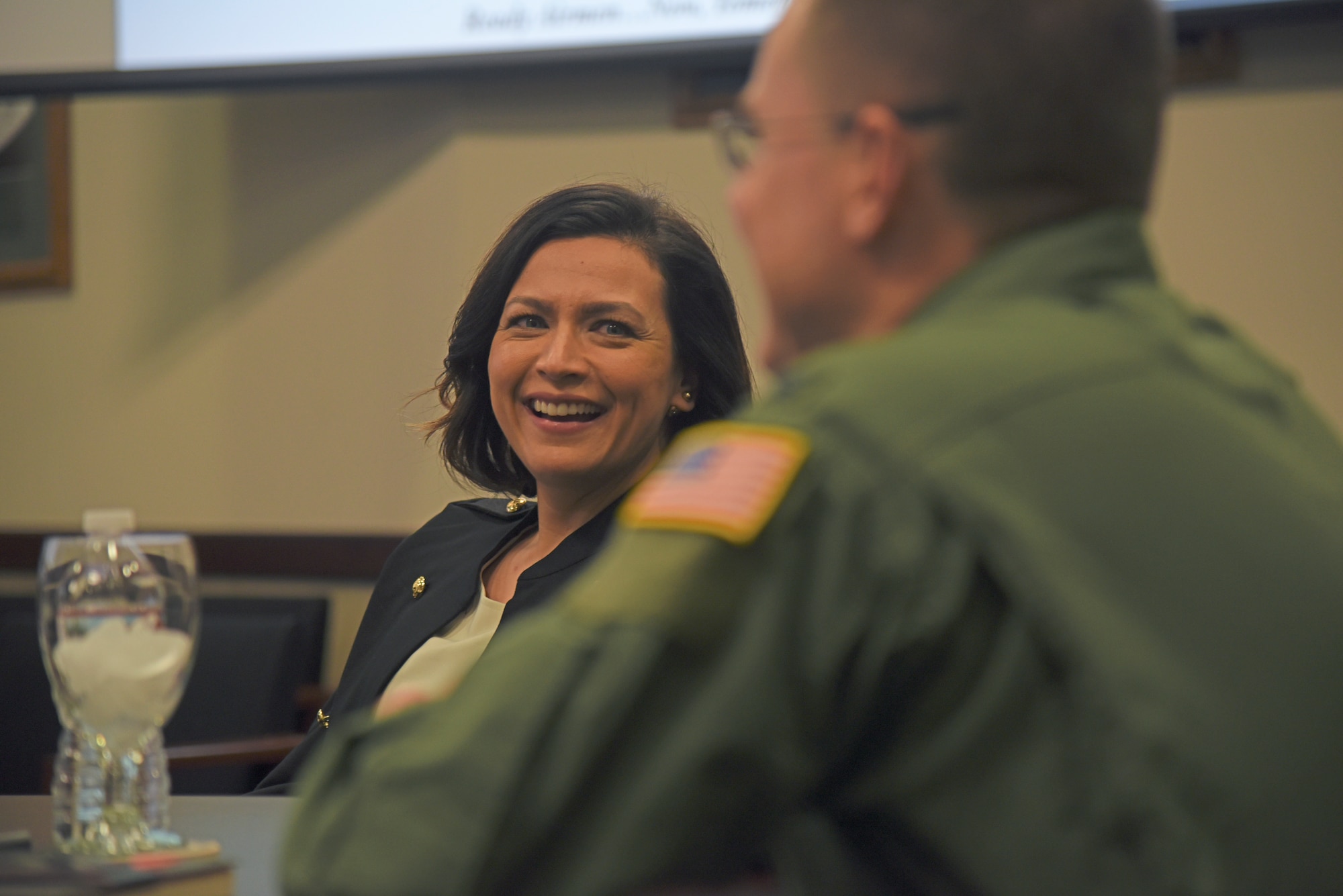 Dr. Addy Wissel, Gonzaga University School Counseling Program director and assistant professor, joins Col. Scot Heathman for a mission brief during a base tour at Fairchild Air Force Base, Washington, April 17, 2018. The Master of Arts in School Counseling Program prepares students for a career as a professional counselor in the K-12 school setting. The program features a group model, which allows students to progress through the two-year program with the same small group of peers and build a valuable professional network of supportive colleagues. (U.S. Air Force photo/Senior Airman Mackenzie Richardson)