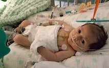 Noah Mockovciak, Team Shaw child, lies in his bed at a hospital at Charleston, S.C., after open heart surgery, circa February 2017.