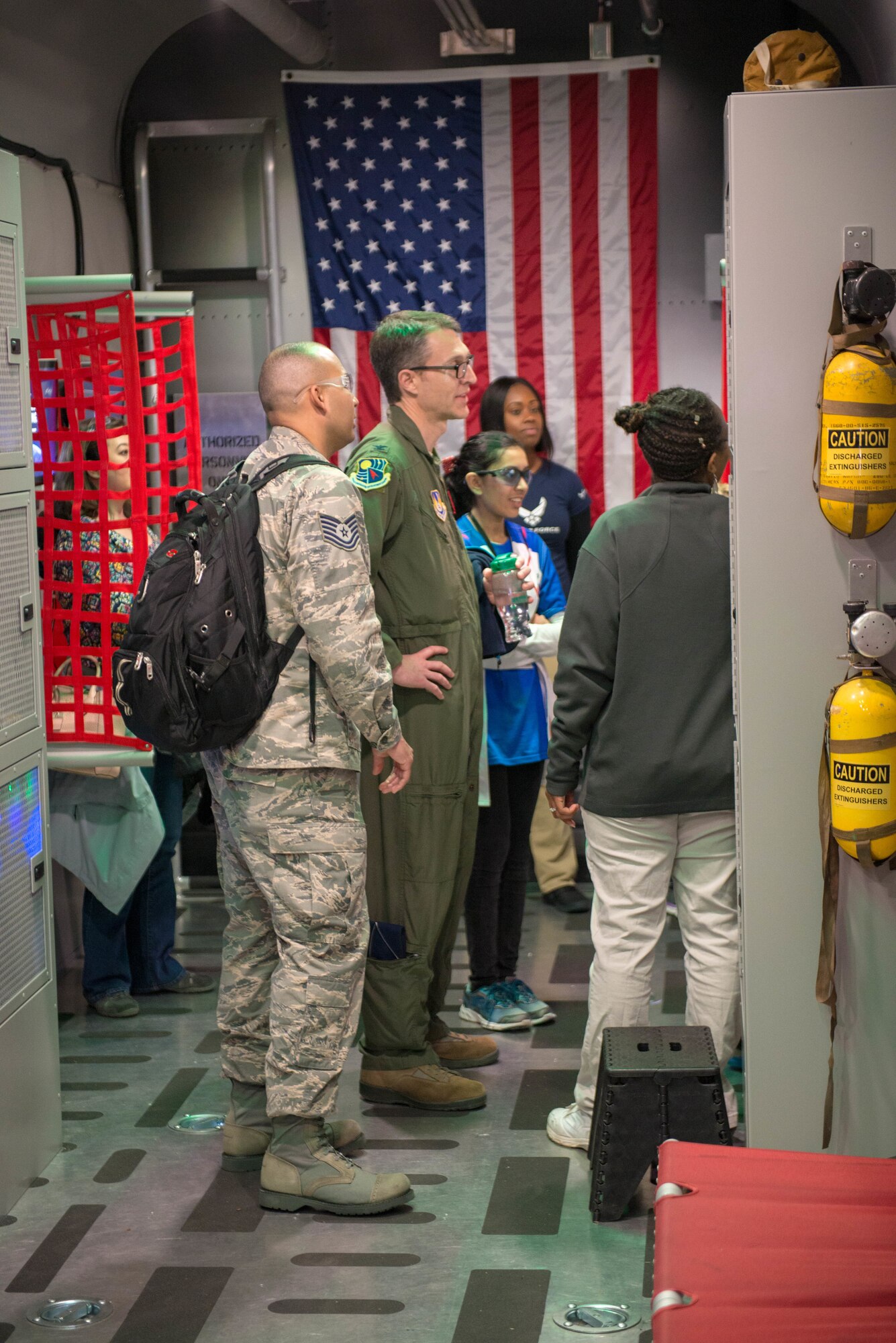 Technical Sgt. Eric W. Williams, U.S. Air Force recruiter, briefs U.S. Air Force Col. Scott A. Cain, Arnold Engineering Development Complex commander, on the U.S. Air Force Recruiting Special Operations Air Commando Experience mobile asset while attending the 2018 FIRST® Robotics Competition Rocket City Regional at the Von Braun Center in Huntsville, Alabama, March 17, 2018. Cain’s demonstration included several Science, Technology, Engineering and Mathematics, and Virtual Reality simulators within the C-130 Hercules replica trailer that showcases the U.S. Air Force Special Operation’s unique missions and opportunities available to potential recruits. (U.S. Air Force photo/Christopher Warner)