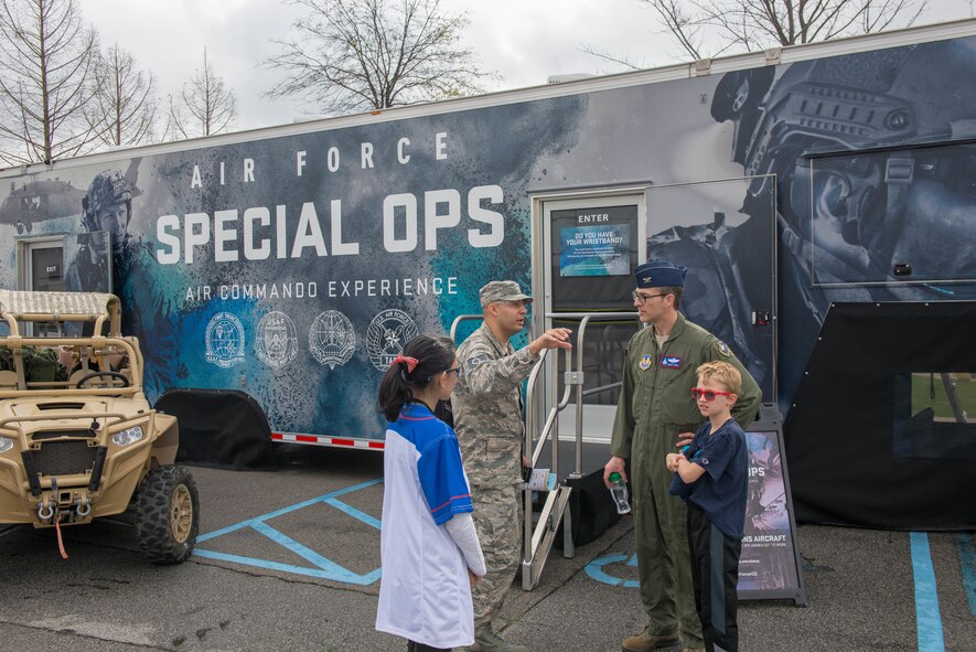 Technical Sgt. Eric W. Williams, U.S. Air Force recruiter, explains the recruiting mission to U.S. Air Force Col. Scott A. Cain, Arnold Engineering Development Complex commander, while attending the 2018 FIRST® Robotics Competition Rocket City Regional at the Von Braun Center in Huntsville, Alabama, March 17, 2018. Mobile assets like the Special Operations Air Commando Experience allow recruiters to showcase how the U.S. Air Force uses Science, Technology, Engineering and Mathematics in a variety of missions and assignments. (U.S. Air Force photo/Christopher Warner)