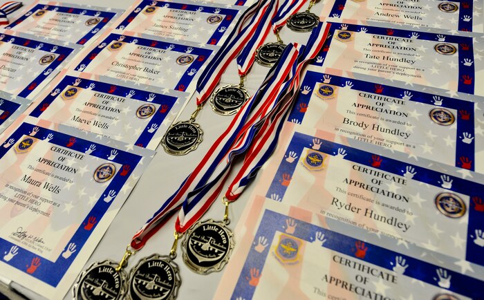 Medals and certificates are displayed neatly on a table prior to the Airman and Family Readiness Center’s “Little Heroes” ceremony April 18, 2018, at Joint Base Charleston, S.C.