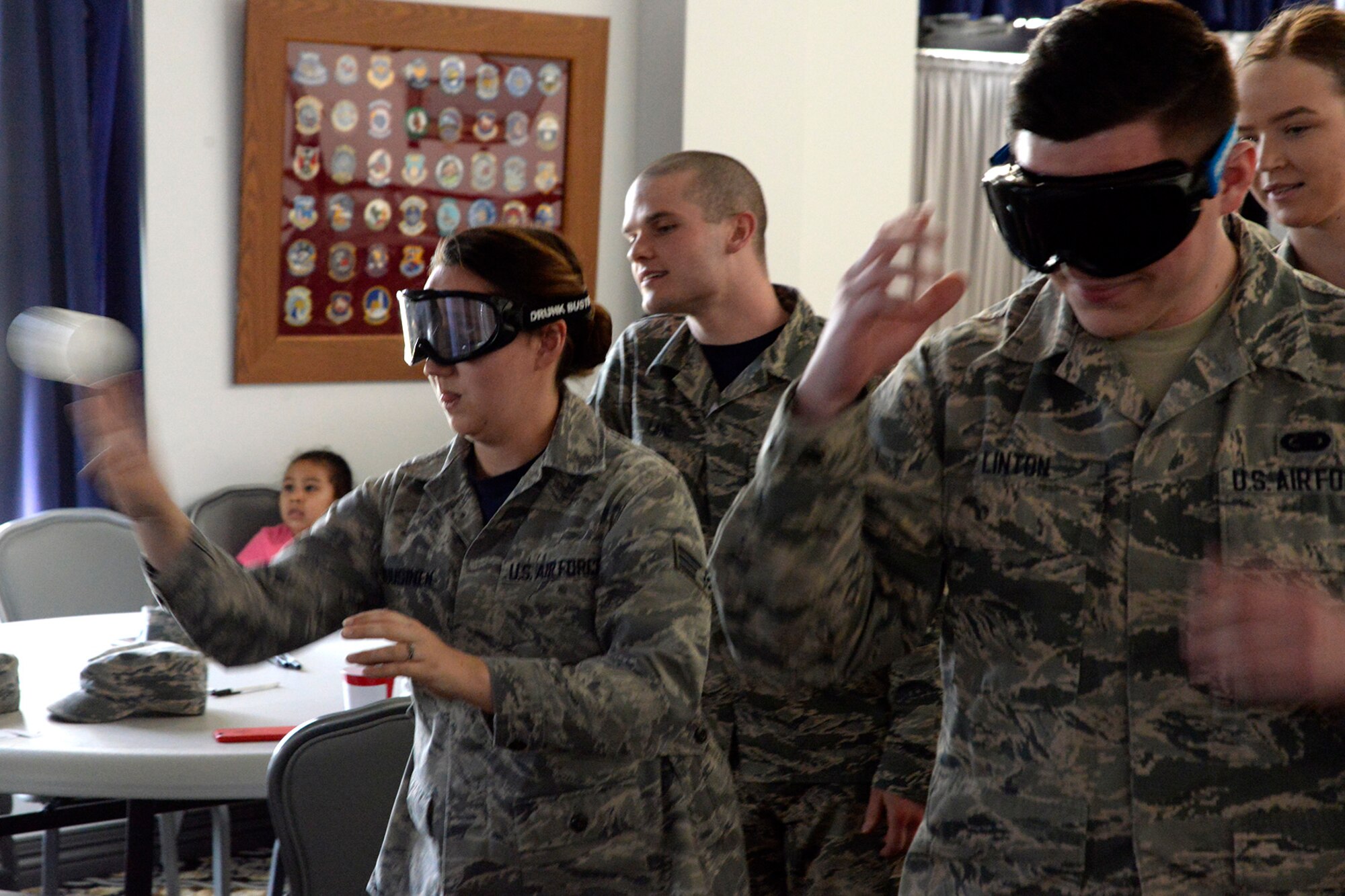 Team Dover Airmen participate in activities to show the effects of alcohol during a drinking responsibly event April 13, 2018, at the Landings on Dover Air Force Base, Del. The Airmen Committed to Excellence Council provides Airmen with opportunities to network, lead and step out of their comfort zone. (U.S. Air Force photo/Tech. Sgt. Matt Davis)