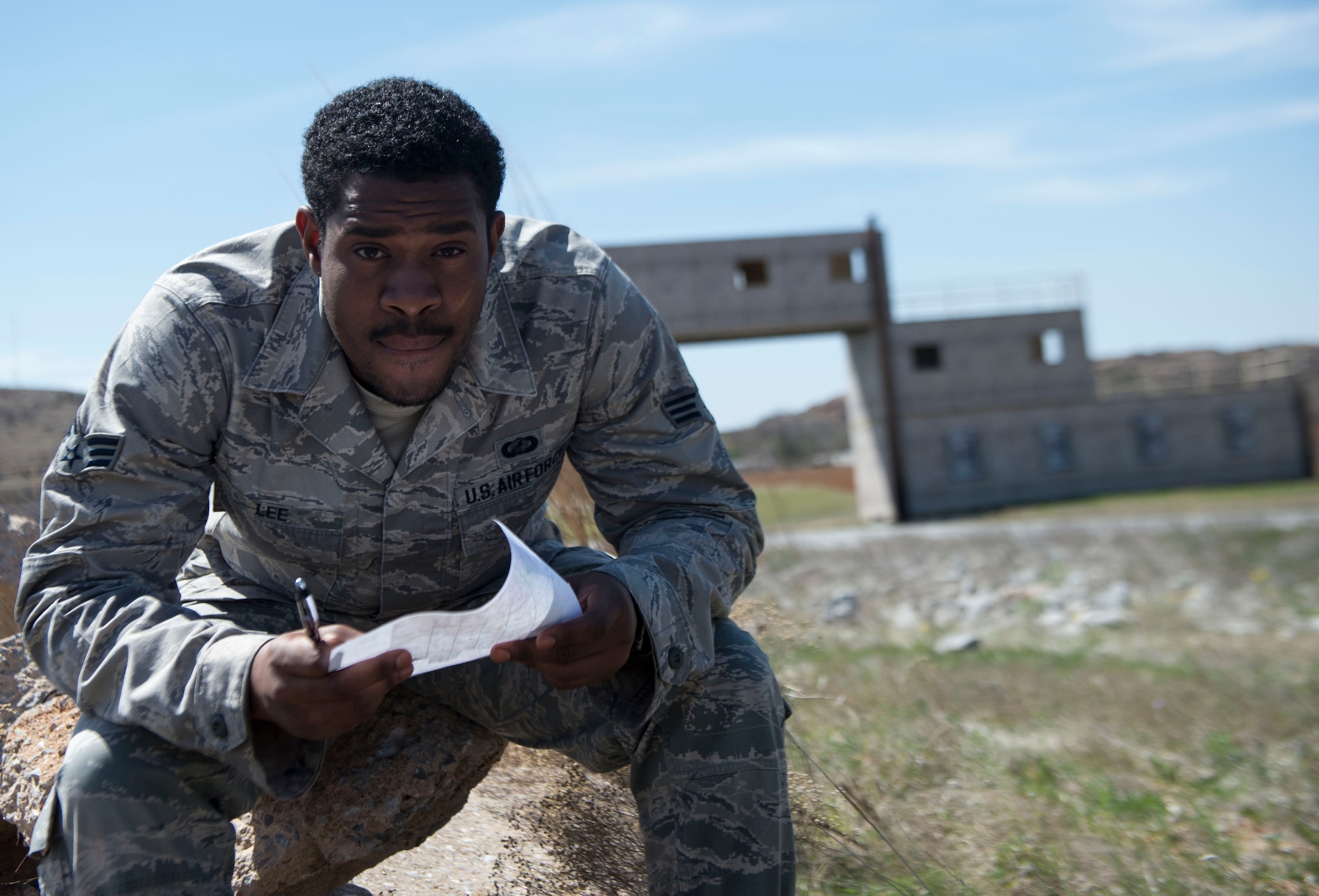 Senior Airman Philip Lee, a contracting specialist assigned to the 97th Contracting Squadron, leaps over a creek during a contracting contingency exercise, April 18, 2018, Fort Sill, Okla. Contracting Airmen from five different bases came together to exercise Operational Contract Support in a deployed environment. (U.S. Air Force photo by Airman Jeremy Wentworth)
