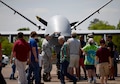 Airmen assigned to the 432nd Wing/432nd Air Expeditionary Wing from Creech Air Force Base, Nev., speak to the attendees of the 2018 Wings Over Columbus Air and Space Show about the MQ-9 Reaper and it’s capabilities April 21, 2018, at Columbus Air Force Base, Mississippi. This was the first Air Force event the MQ-9 and its aircrew attended during the 2018 season and marked the first time the aircraft was at Columbus Air Force Base. (U.S. Air Force photo by Airman 1st Class Keith Holcomb)
