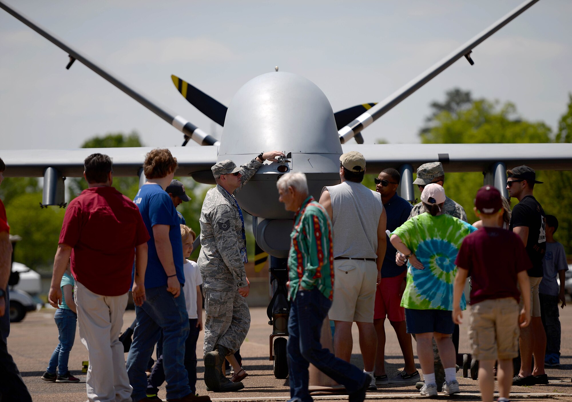 Airmen assigned to the 432nd Wing/432nd Air Expeditionary Wing from Creech Air Force Base, Nev., speak to the attendees of the 2018 Wings Over Columbus Air and Space Show about the MQ-9 Reaper and it’s capabilities April 21, 2018, at Columbus Air Force Base, Mississippi. This was the first Air Force event the MQ-9 and its aircrew attended during the 2018 season and marked the first time the aircraft was at Columbus Air Force Base. (U.S. Air Force photo by Airman 1st Class Keith Holcomb)