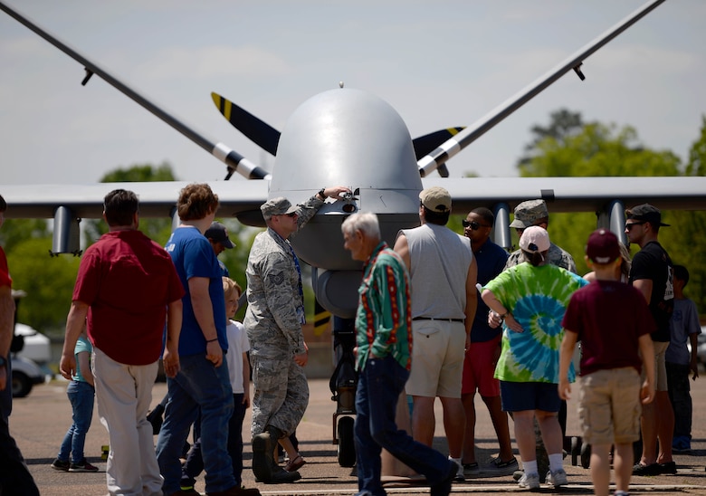 Airmen assigned to the 432nd Wing/432nd Air Expeditionary Wing from Creech Air Force Base, Nev., speak to the attendees of the 2018 Wings Over Columbus Air and Space Show about the MQ-9 Reaper and it’s capabilities April 21, 2018, at Columbus Air Force Base, Mississippi. This was the first Air Force event the MQ-9 and its aircrew attended during the 2018 season and marked the first time the aircraft was at Columbus Air Force Base. (U.S. Air Force photo by Airman 1st Class Keith Holcomb)