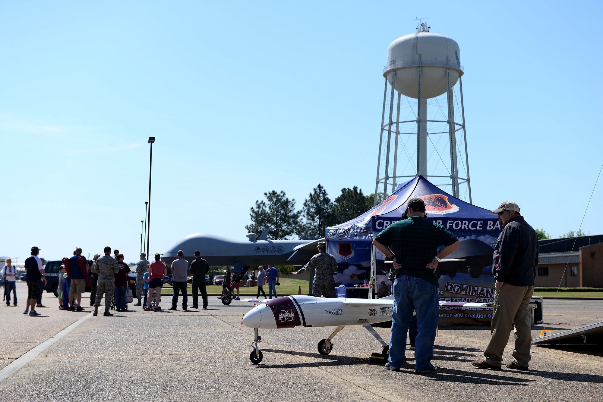 The Mississippi State University’s unmanned aircraft systems drone is displayed next to the Air Force’s Remotely Piloted MQ-9 Reaper during the 2018 Wings Over Columbus Air and Space Show April 21, 2018, at Columbus Air Force Base, Mississippi. MSU’s UAS program is the Federal Aviation Administration’s Center of Excellence for unmanned aircraft systems. The university spent their time at the air show educating the public about these aircraft alongside the Airmen from the 432nd Wing/432nd Air Expeditionary Wing. (U.S. Air Force photo by Airman 1st Class Keith Holcomb)