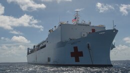 PACIFIC OCEAN (March 20, 2018) Military Sealift Command hospital ship USNS Mercy (T-AH 19) anchors in waters near the Ulithi Atoll while en route for its first mission stop of Pacific Partnership 2018 (PP18).