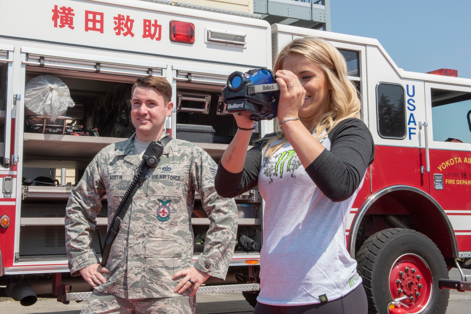 Paige VanZant, a UFC fighter, views through a thermal imaging camera during the USO Spring Tour at Yokota Air Base, Japan, April 22, 2018.