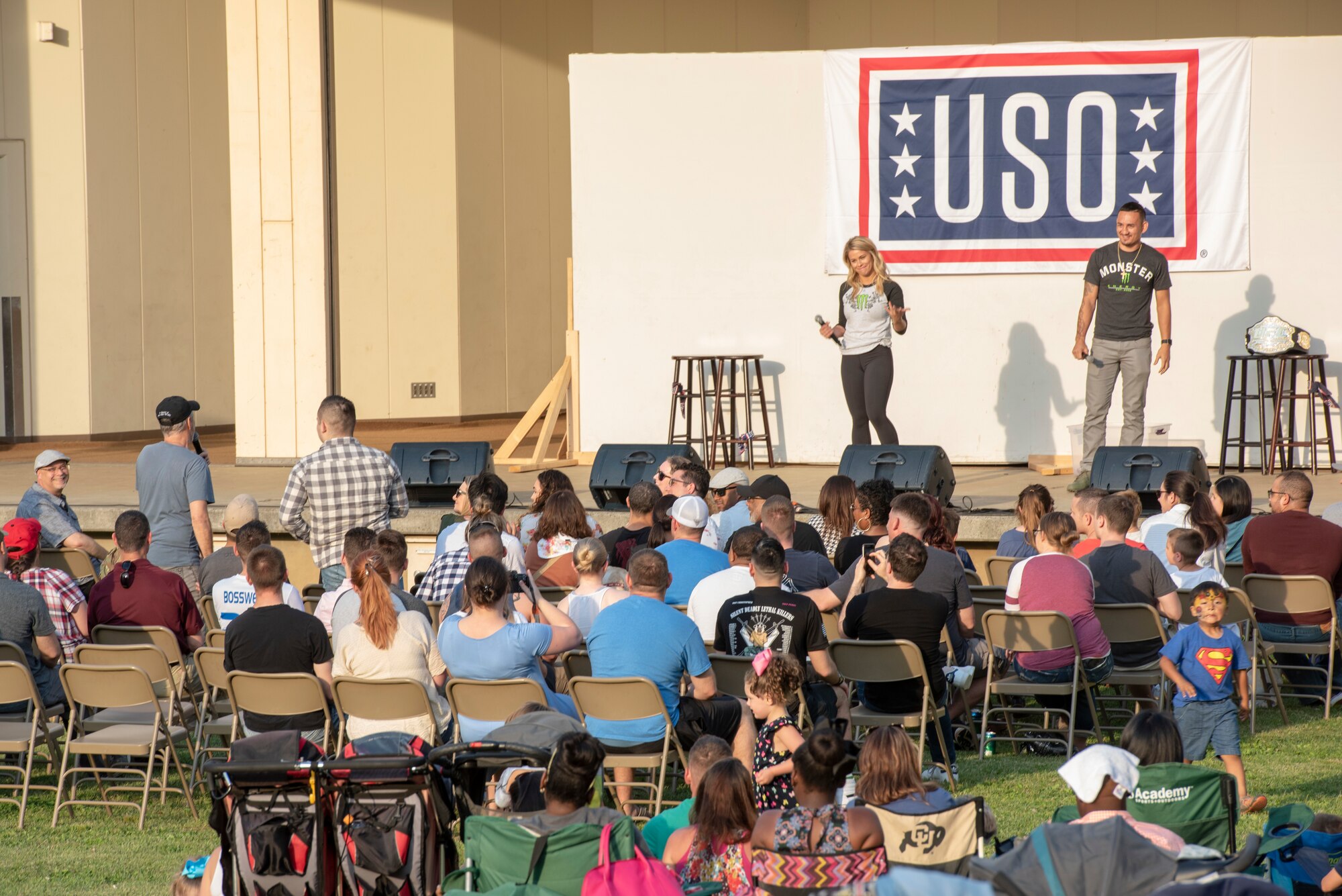Max Holloway and Paige VanZant, both UFC fighters, answers questions from the crowd during the USO Spring Tour at Yokota Air Base, Japan, April 22, 2018.