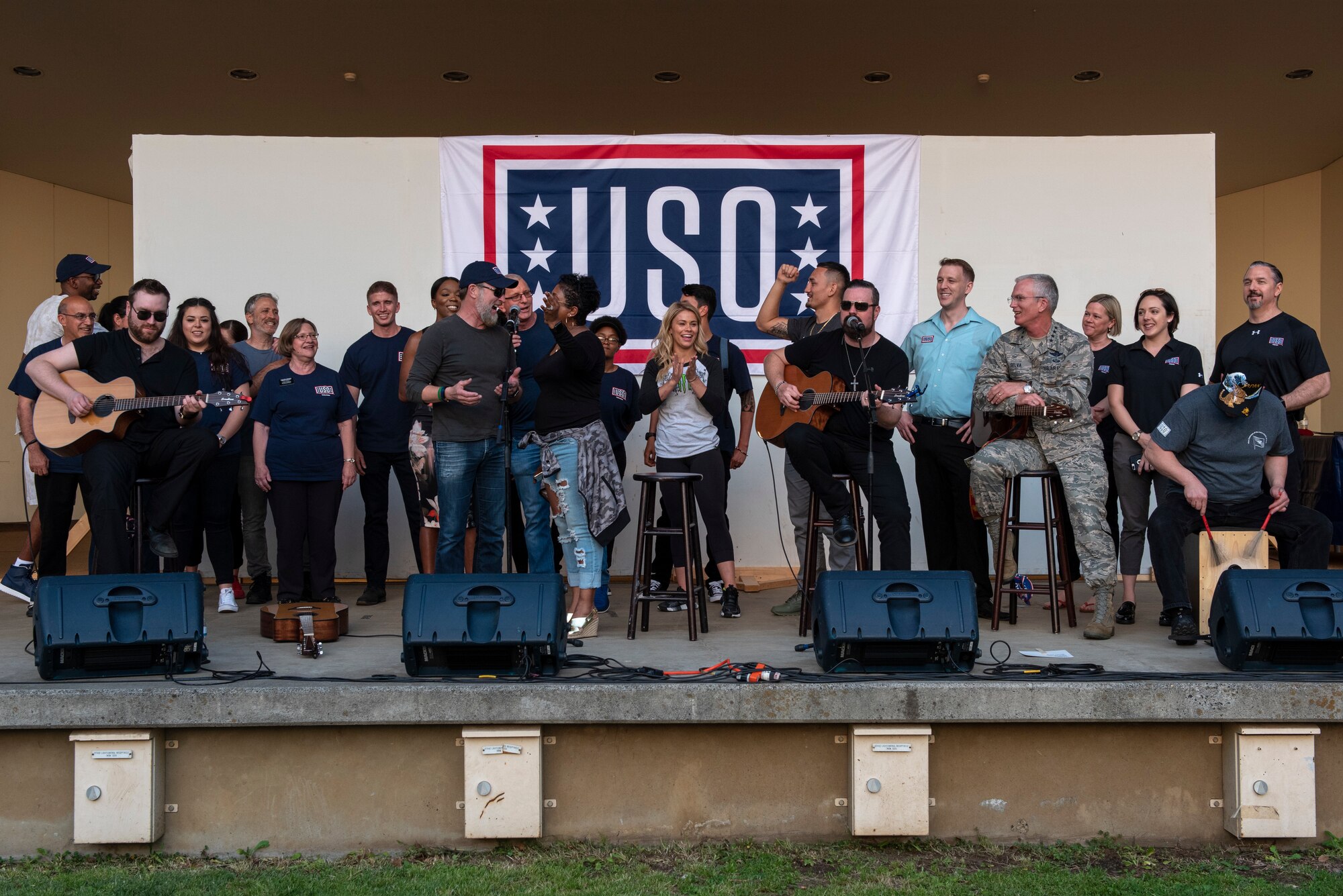 Craig Morgan, country music artist and U.S. Army veteran, is joined on stage by all of the performers and USO volunteers for one final song at the USO Spring Tour at Yokota Air Base, Japan, April 22, 2018.