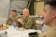 Gen. John W. "Jay" Raymond, commander of Air Force Space Command, and Brig. Gen. Kyle W. Robinson, 332nd Air Expeditionary Wing commander, listen to questions from Airmen Apr. 23, 2018 at an undisclosed location in Southwest Asia.
