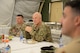 Gen. John W. "Jay" Raymond, commander of Air Force Space Command, and Brig. Gen. Kyle W. Robinson, 332nd Air Expeditionary Wing commander, listen to questions from Airmen Apr. 23, 2018 at an undisclosed location in Southwest Asia.
