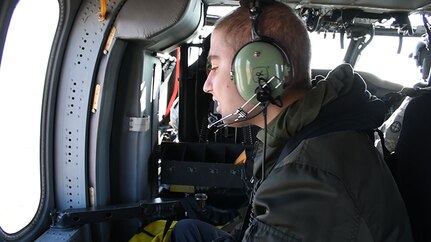Seth Cummings flies above Topeka, Kansas, aboard a Black Hawk helicopter from the 1st Battalion 108th Aviation Regiment as part of a Make-A-Wish  foundation dream come true on March 30, 2018.