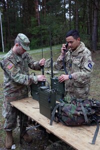 US and British Army Soldiers set up radios