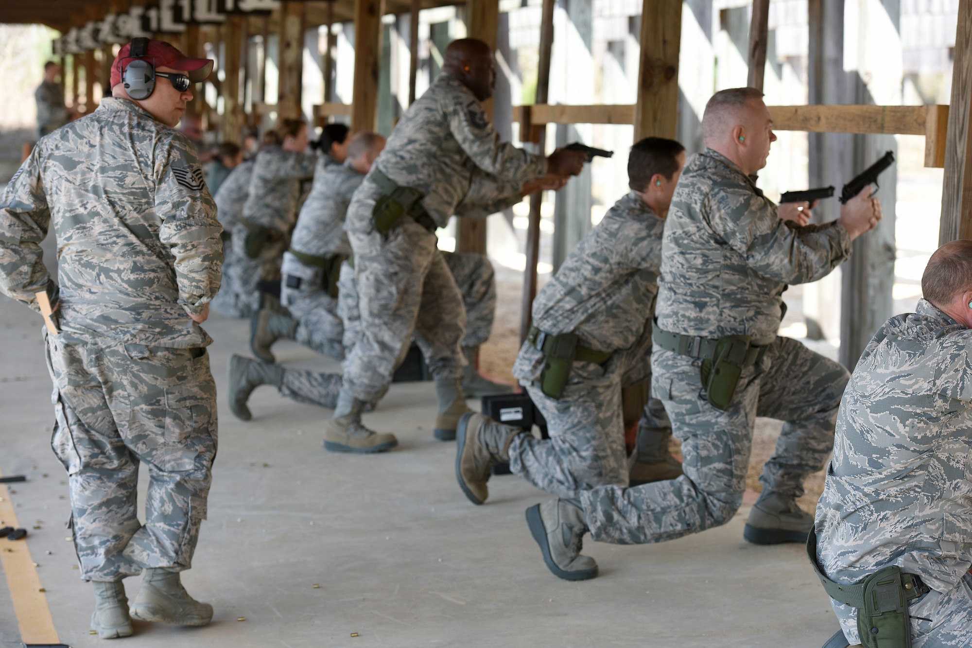 U.S. Air Force Tech. Sgt. Ismael Fierro, a Combat Arms Training and Maintenance instructor with the 169th Security Forces Squadron at McEntire Joint National Guard Base, South Carolina Air National Guard, monitors Airmen during M-9 pistol qualifications at the base shooting range, April 6, 2018. Swamp Fox Airmen continue to hone routine skills to meet combatant command requirements. The muscle memory that is formed by using this equipment multiple times allows Airmen the ability to focus their attention on completing the mission under austere 
conditions.  (U.S. Air National Guard photo by Master Sgt. Caycee Watson)