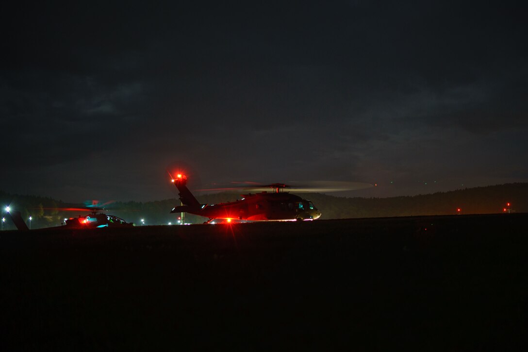 Helicopter prepare to take off at night.
