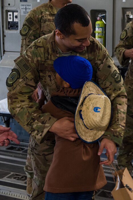 Local child greets airman in Guatemala.