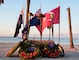 Wreaths and poppies lie below an Anzac Day memorial following a dawn service on the beach at MacDill Air Force Base, April 25. Personnel from U.S. Central Command, U.S. Special Operations Command, and other base commands attended the commemoration service that marks the anniversary of the military campaign on the Gallipoli Peninsula fought by Australian and New Zealand forces during World War I.  ANZAC Day also commemorates the lives lost by Australians and New Zealanders during World War II and subsequent military and peacekeeping operations. (Photo by Tom Gagnier)