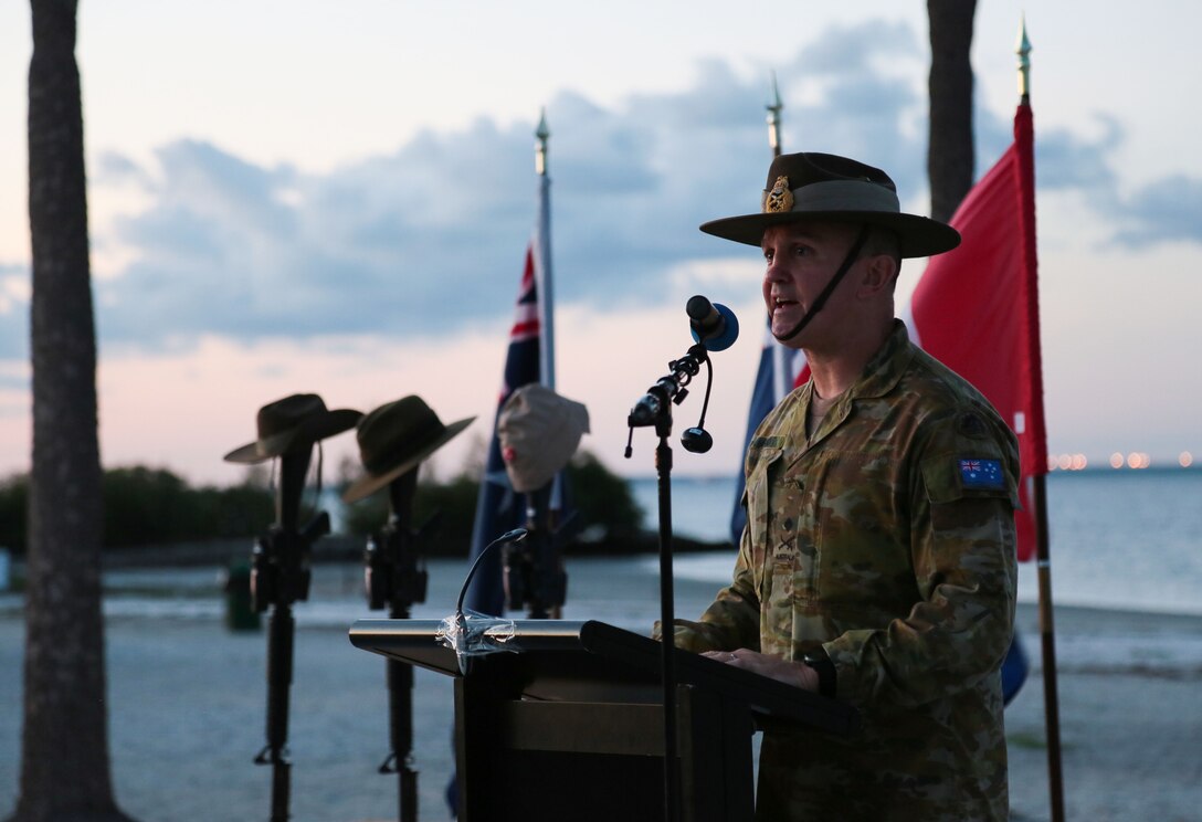 Australian Army Major General Chris Field, vice director (CCJ3), U.S. Central Command, addresses attendees at an Anzac Day dawn service on the beach at MacDill Air Force Base, April 25. Personnel from U.S. Central Command, U.S. Special Operations Command, and other base commands attended the commemoration service that marks the anniversary of the military campaign on the Gallipoli Peninsula fought by Australian and New Zealand forces during World War I.  Anzac Day also commemorates the lives lost by Australians and New Zealanders during World War II and subsequent military and peacekeeping operations. (Photo by Tom Gagnier)