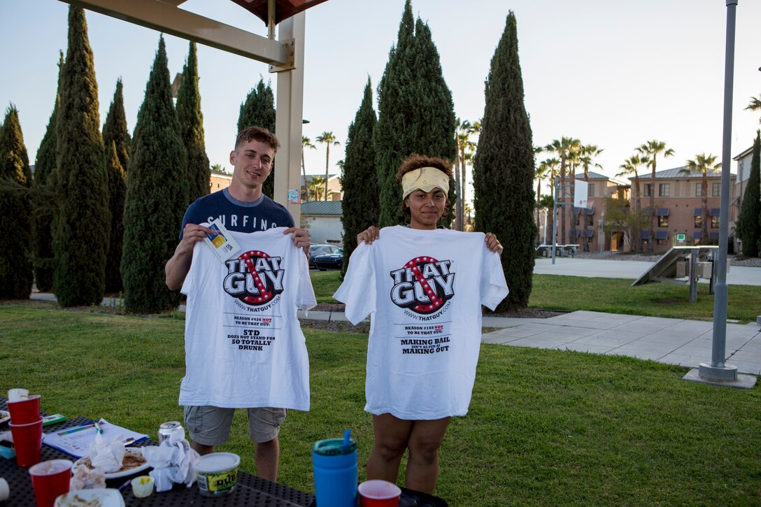 Lance Cpl. Serena Hurt, a property clerk with Marine Aviation Logistics Squadron 11, right, and Cpl. Tyler Welch, a food service specialist with Marine Wing Support Squadron 373, left, hold the T-shirts they won during the annual Unwasted Warrior Weekend at Marine Corps Air Station Miramar, Calif., April 20 to 23. Over the weekend, members of Marine Corp Community Services Miramar and the Single Marine Program hosted several events promoting Alcohol Awareness Month with sponsored activities and prize giveaways encouraging Marines and Sailors to find alternatives to consuming alcohol. “We are trying to show that there are multiple things you can do to occupy your time and still have fun without alcohol whether it is sporting events, trying something new or just old-fashioned fun,” said Katie Weeres, Single Marine Program coordinator at MCAS Miramar. (U.S. Marine Corps photo by Cpl. Becky Calhoun/Released)