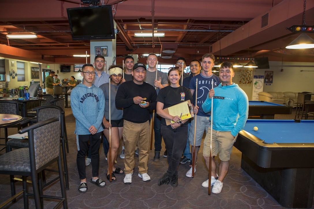Marines participate in an eight-ball pool tournament during the annual Unwasted Warrior Weekend in The Great Escape on Marine Corps Air Station Miramar, Calif., April 20 to 23. The pool tournament was one of several events promoting Alcohol Awareness Month with sponsored activities and prize giveaways encouraging Marines and Sailors to find alternatives to consuming alcohol. “We are trying to show that there are multiple things you can do to occupy your time and still have fun without alcohol – whether it is sporting events, trying something new or just old-fashioned fun,” said Katie Weeres, Single Marine Program coordinator at MCAS Miramar. (U.S. Marine Corps photo by Cpl. Becky Calhoun/Released)