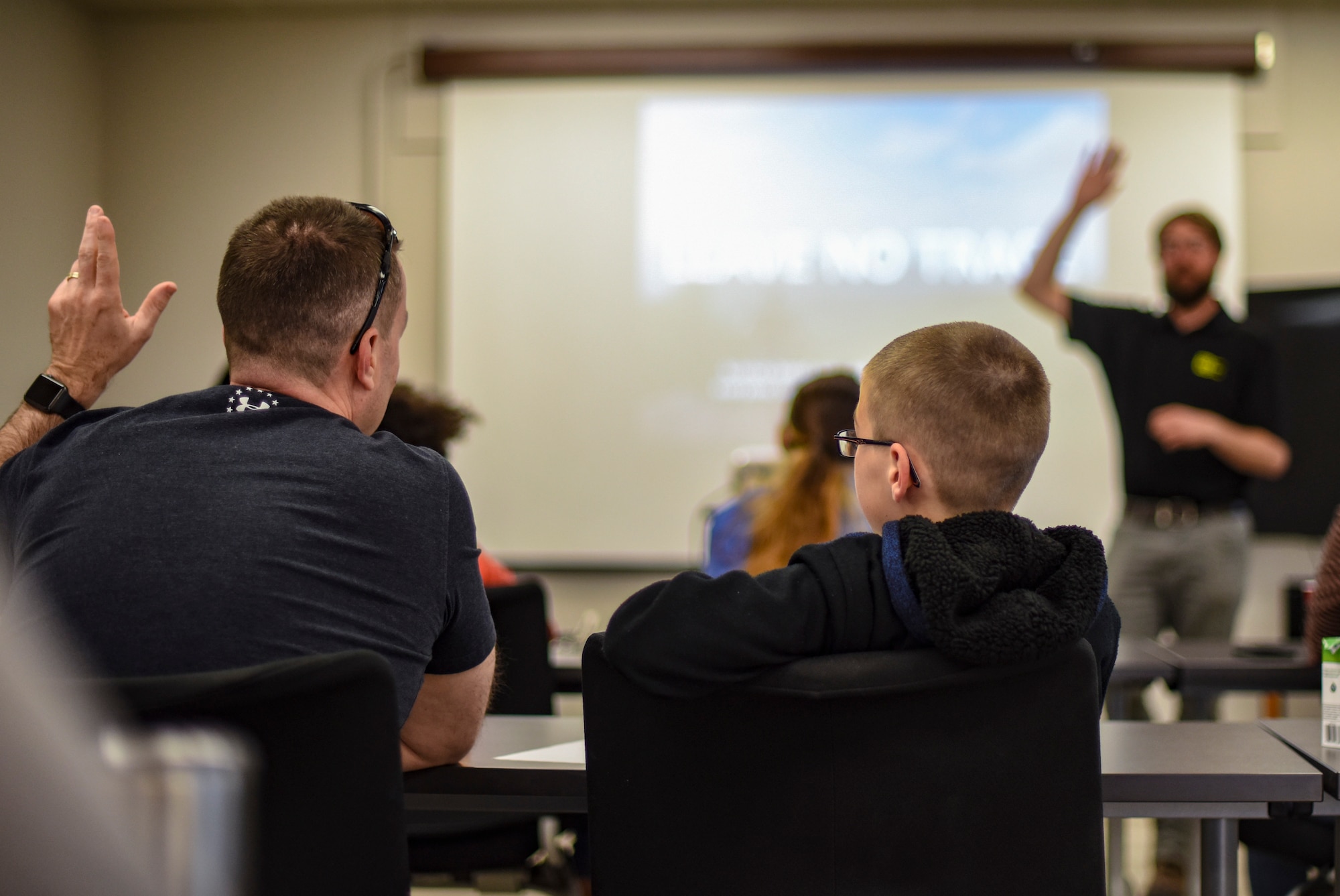 A father and son participate in a Leave No Trace workshop at Nellis Air Force Base, Nevada, March 28, 2018. Participants learned the importance of planning ahead, respecting wildlife and, most importantly, leaving no trace through multiple exercises. (U.S. Air Force photo by Airman 1st Class Andrew D. Sarver)