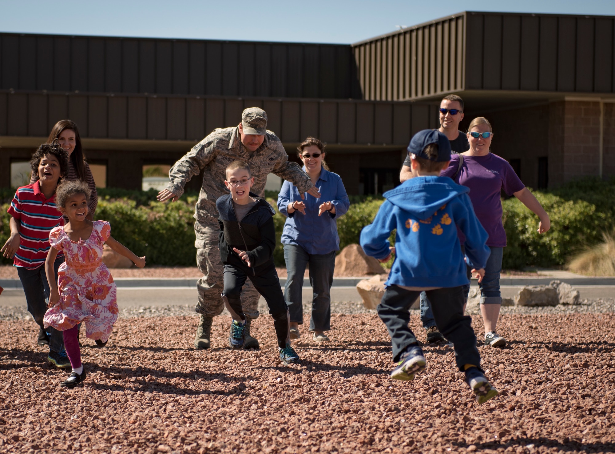 Participants play a game of tag during a Leave No Trace workshop at Nellis Air Force Base, Nevada, March 28, 2018. The game simulated how invasive species can have a negative impact on the environment. (U.S. Air Force photo by Airman 1st Class Andrew D. Sarver)