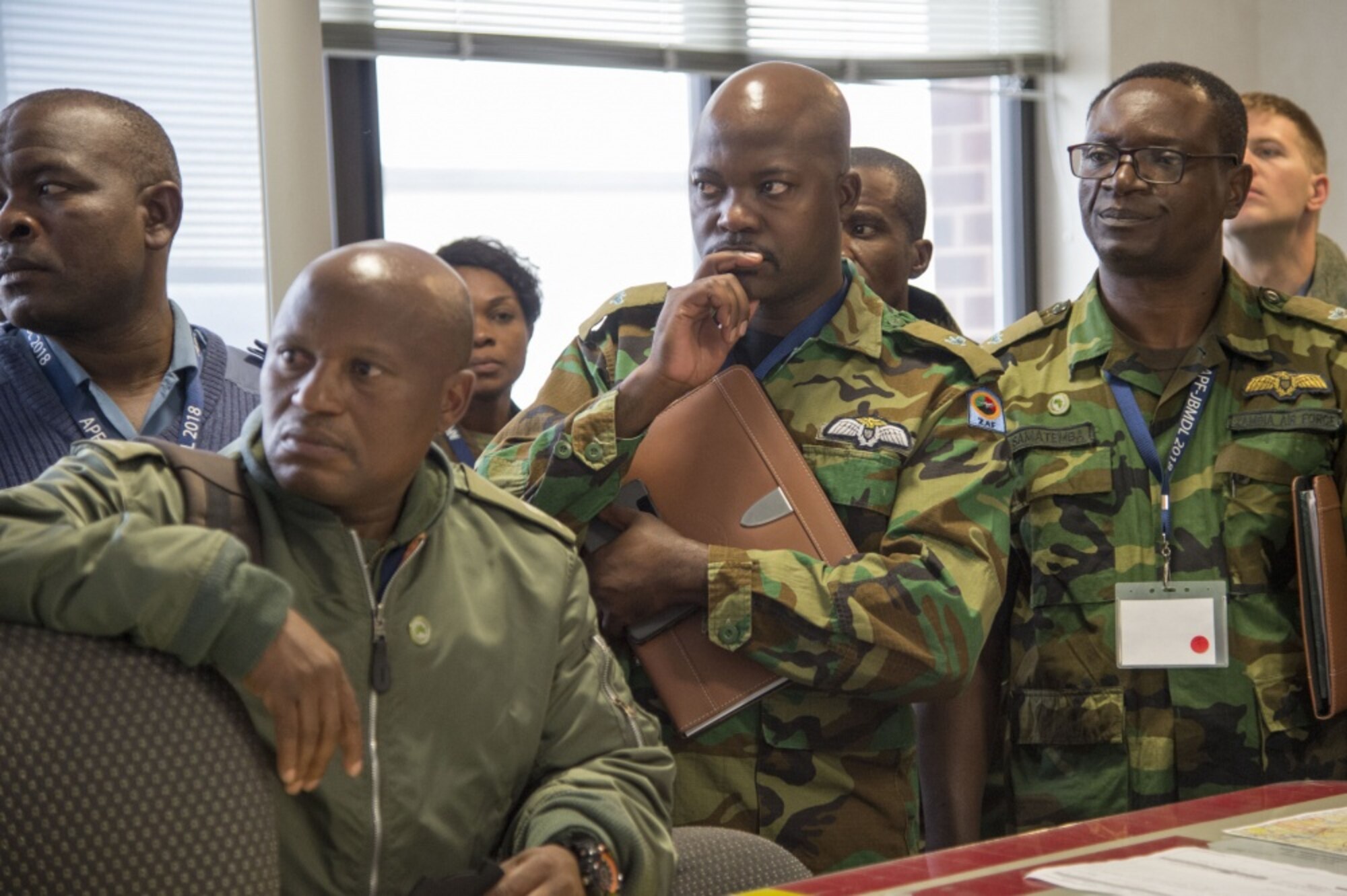 Participants of the African Partnership Flight engagement listen to an operations briefing at Joint Base McGuire-Dix-Lakehurst, N.J., April 17, 2018. U.S. Air Forces Africa has advocated increased air engagement in Africa and APF is the next step in providing persistent diplomatic, informational, humanitarian, economic and other non-threatening outreach efforts to support the diverse people and nations.