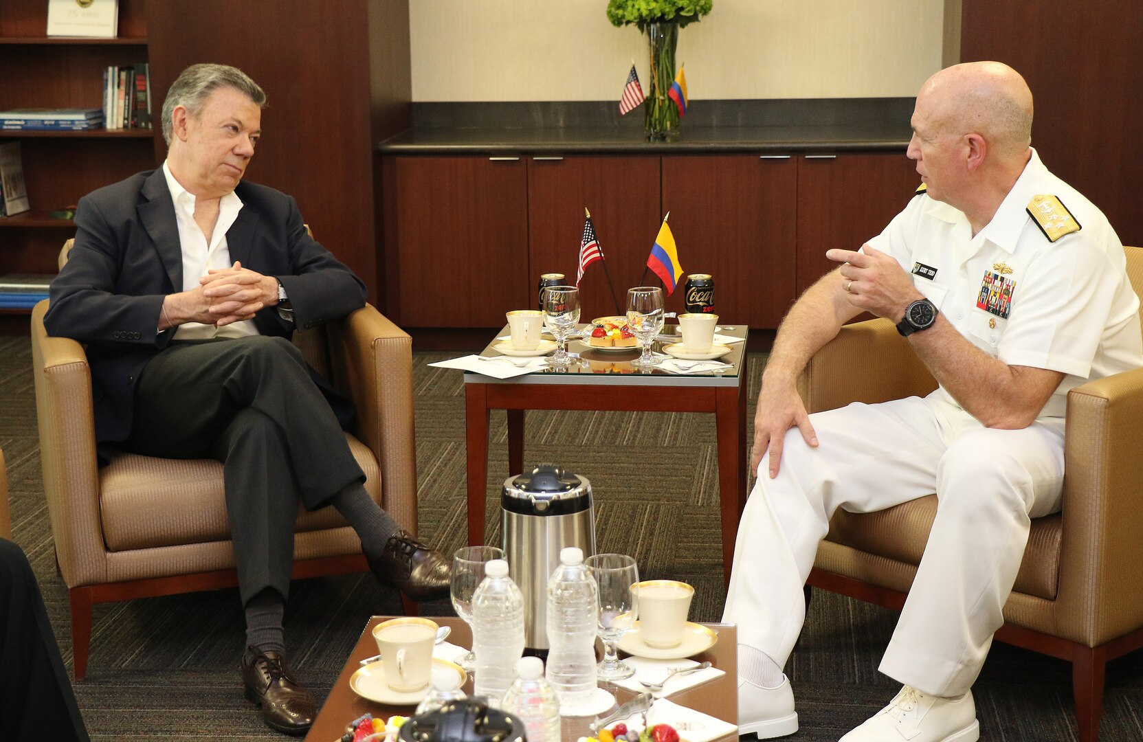 Colombian President Juan Manuel Santos and U.S. Navy Adm. Kurt W. Tidd talk during private meeting