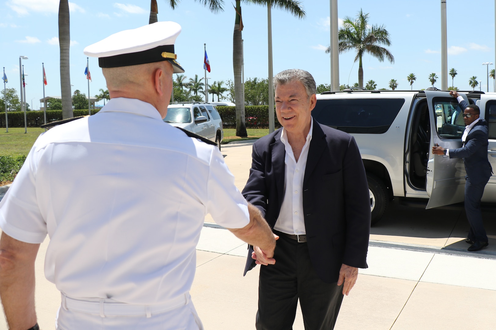 Colombian President Juan Manuel Santos and U.S. Navy Adm. Kurt W. Tidd greet each other
