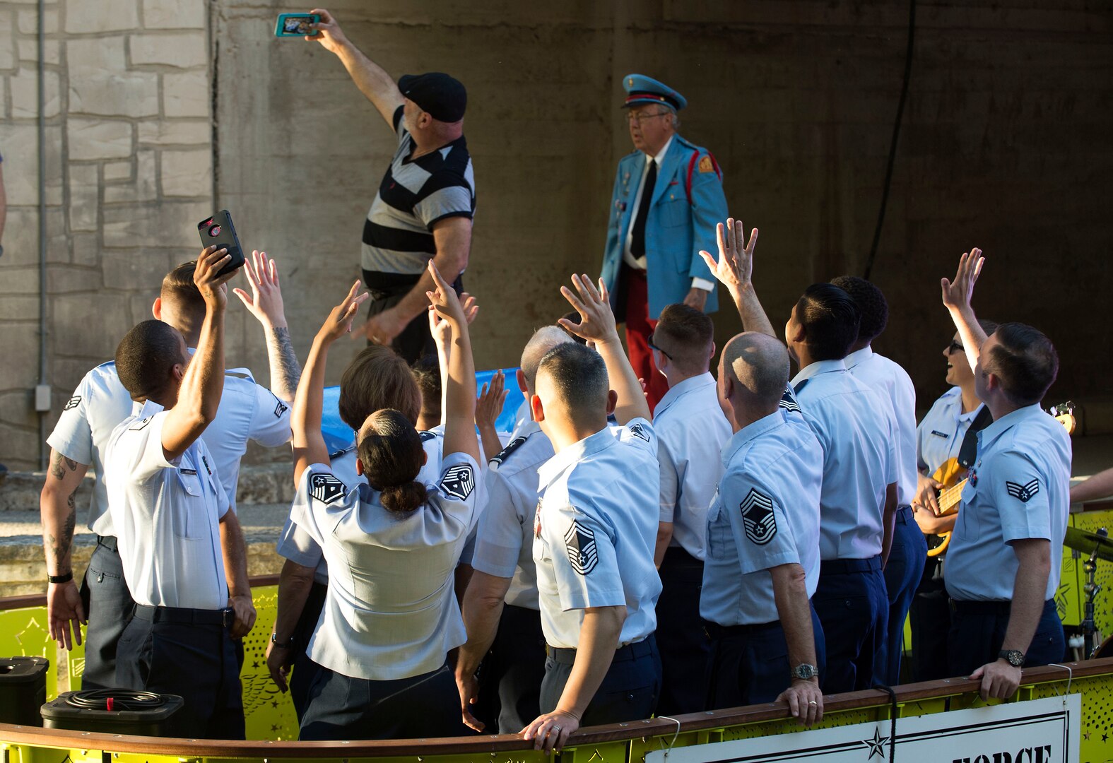 A Texas Cavaliers River Parade attendee takes a selfie with Air Forces Cyber Airmen during the 2018 Fiesta San Antonio event, April 23. Fiesta San Antonio is held annually to honor those who lost their lives at the Alamo and Battle of San Jacinto. (U.S. Air Force photo by Tech. Sgt. R.J. Biermann)