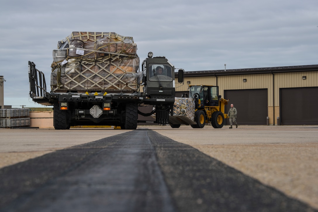 Air Force reservists in the 67th Aerial Port Squadron prepare to load cargo aboard a C-5 Galaxy