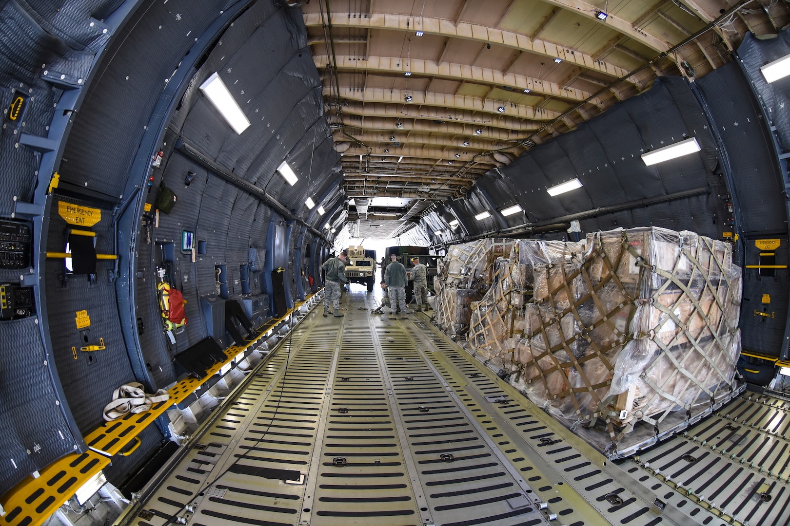 Air Force reservists in the 67th Aerial Port Squadron load cargo aboard a C-5 Galaxy
