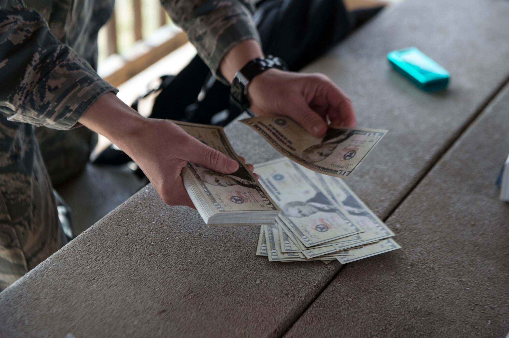 1st Lt. Elizabeth McKenna, a contracting officer for the 82nd Contracting Squadron at Goodfellow AFB, counts fake money during a contracting contingency exercise, April 17, 2018, Fort Sill, Okla. Contracting Airmen from five different bases came together to exercise Operational Contract Support in a deployed environment. (U.S. Air Force photo by Airman Jeremy Wentworth)